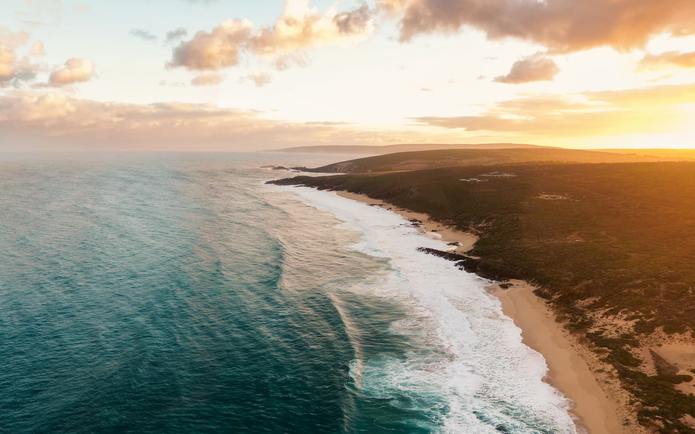 Aerial sunset over a Yallingup-like coast